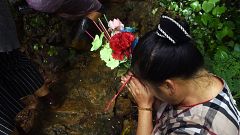 Image: A woman prays 