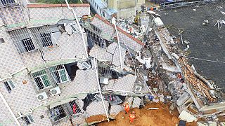 Scores buried as mudslide engulfs buildings in China