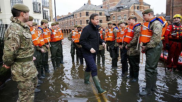 Cameron promises more funds for flood defence Cameron promises more funds for flood defence
