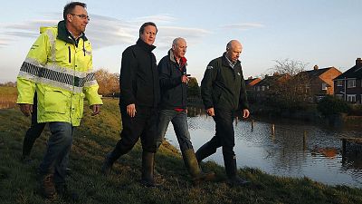 UK: Cameron to review gov't spending on flood defenses