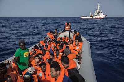 Some of the 60 migrants rescued near the coast of Libya by the Open Arms on Saturday.