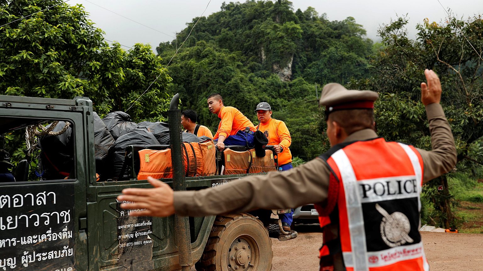 Image: Rescue workers are seen near the Tham Luang cave complex, where 12 s