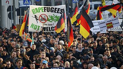 Merkel Calls for Tougher Migrant Laws