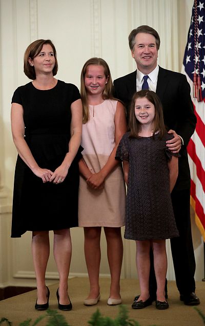 U.S. Circuit Judge Brett M. Kavanaugh stands with his family as President Donald Trump introduces him as his nominee to the United States Supreme Court during an event in the East Room of the White House in Washington on July 9, 2018.