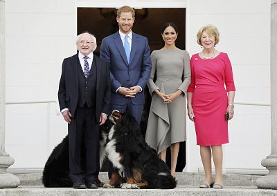 Meghan and Harry posed with Ireland\'s president, Michael Higgins, and his wife, Sabina, along with their family dogs. 