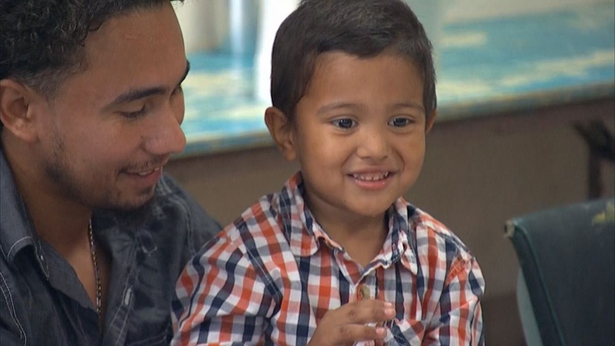 'Hello, Daddy': Migrants reunite with separated children