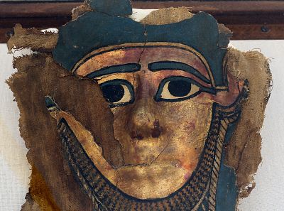 A recently discovered gilded mummy mask is displayed during a press conference in front of the step pyramid of Saqqara, in Giza on July 14, 2018.