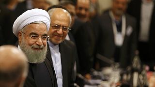 Iran's President Rouhani seeks to revive business ties in Paris