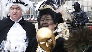 Venice carnival goers asked to lift masks for security