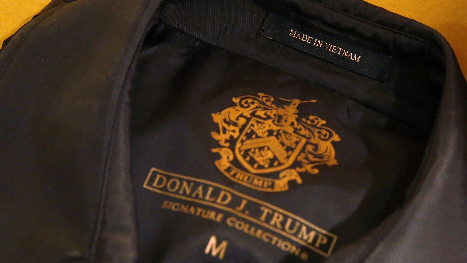 A "Made in Vietnam" label is pictured on an article of clothing in a displa