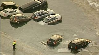 US: Cars parked on frozen lake rescued after ice cracks