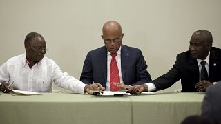 Haitian president agrees to care-taker government