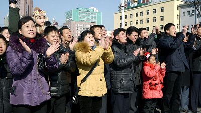 North Koreans celebrate rocket launch