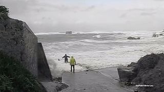 Watch: Elderly couple's close call after being dragged out to sea