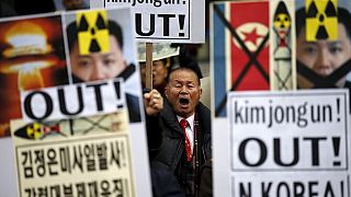 South Koreans protest over neighbour's rocket launch