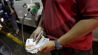 As oil prices slide, Venezuela raises fuel prices by up to 6,000%, devalues currency