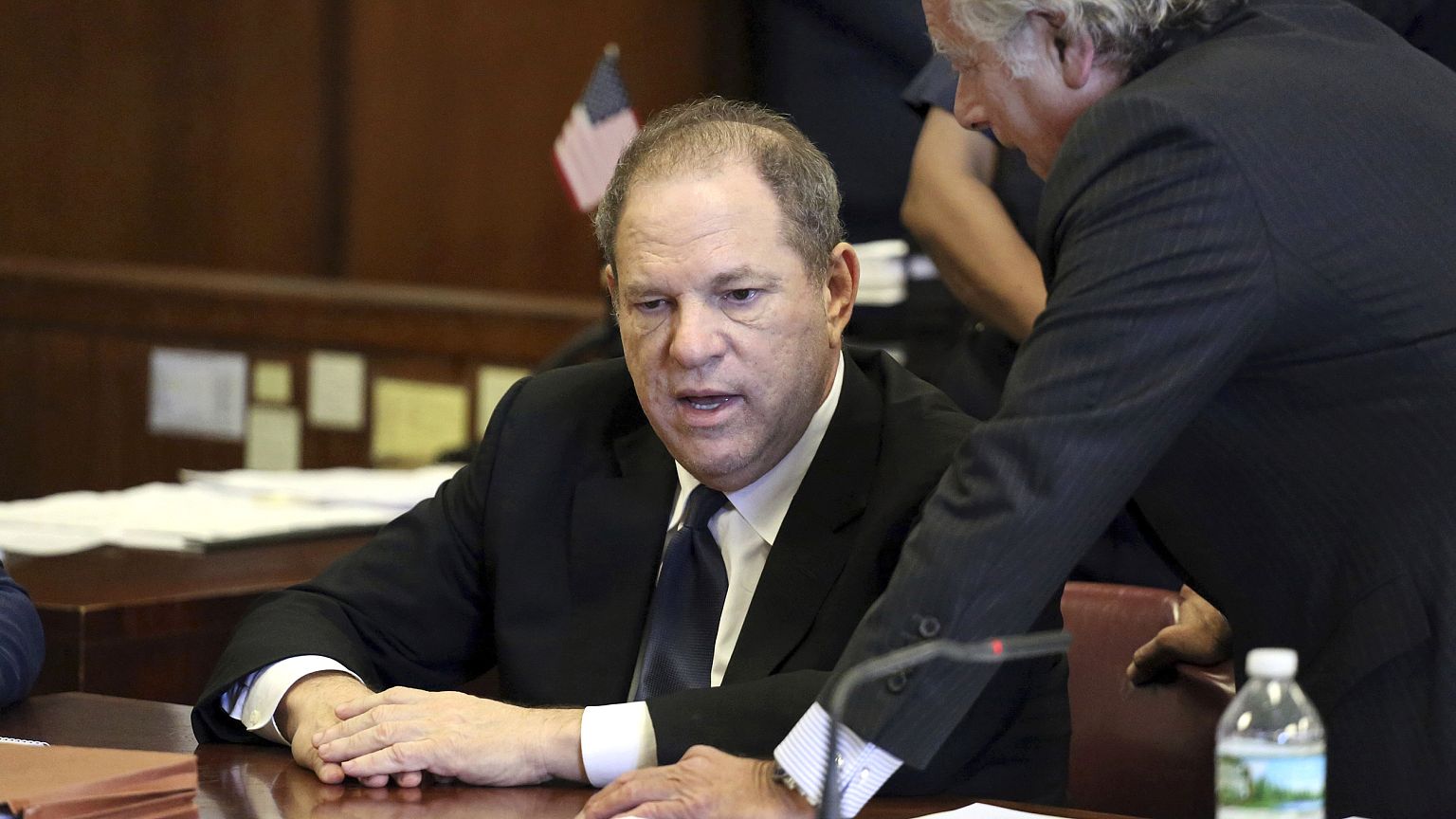 Image: Harvey Weinstein, left, and his attorney Benjamin Brafman talk in co