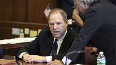 Image: Harvey Weinstein, left, and his attorney Benjamin Brafman talk in co