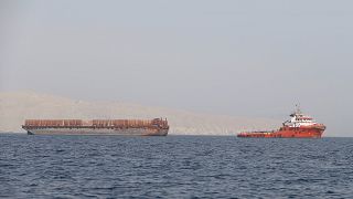 Image: Tug boat moves cargo towards Strait of Hormuz