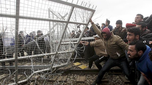 FYROM police fire tear gas at migrants amid Greek border tension FYROM police fire tear gas at migrants amid Greek border tension