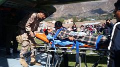 Image: A person is transported to a helicopter after eating contaminated fo
