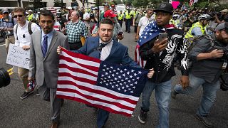 Image: Jason Kessler, center, and members of the alt-right march to the Whi