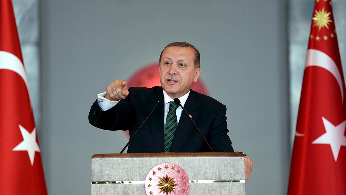 Erdogan warns Turkey's top courts over freed journalists
