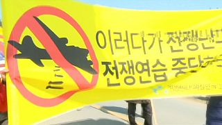 Protest against US-S.Korea war games as Pyongyang 'seeks missing submarine'
