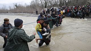 Greek-Macedonian border breached by migrants, as three drown crossing river