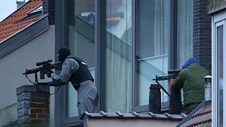 Suspect gunman killed and police hurt in Brussels anti-terror raid