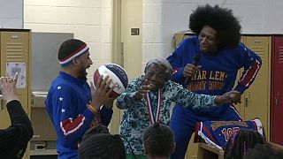 107-year-old woman dances with Harlem Globetrotters