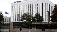 Image: A pedestrian walks past the Russian Embassy in Washington