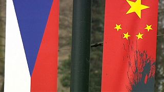 Pro-Tibet activists deface Chinese flags as President Xi arrives in Prague