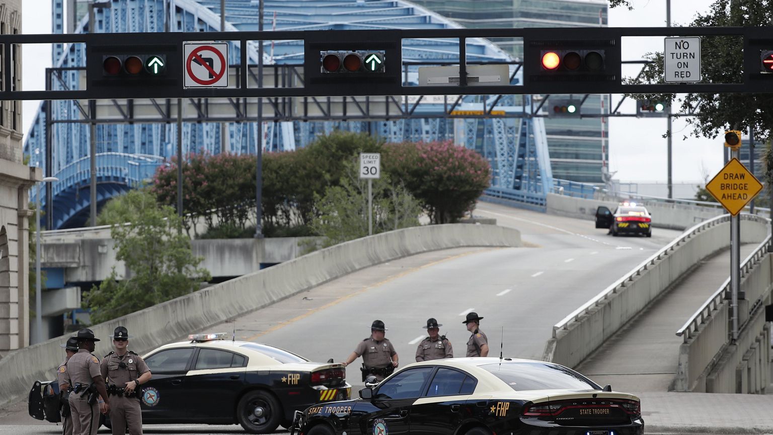 Image: Florida Highway patrolmen block the entrance to the Main Street Brid