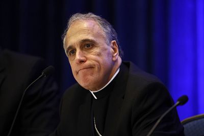 Cardinal Daniel DiNardo, president of the United States Conference of Catholic Bishops, speaks at a news conference during their annual fall meeting in Baltimore.