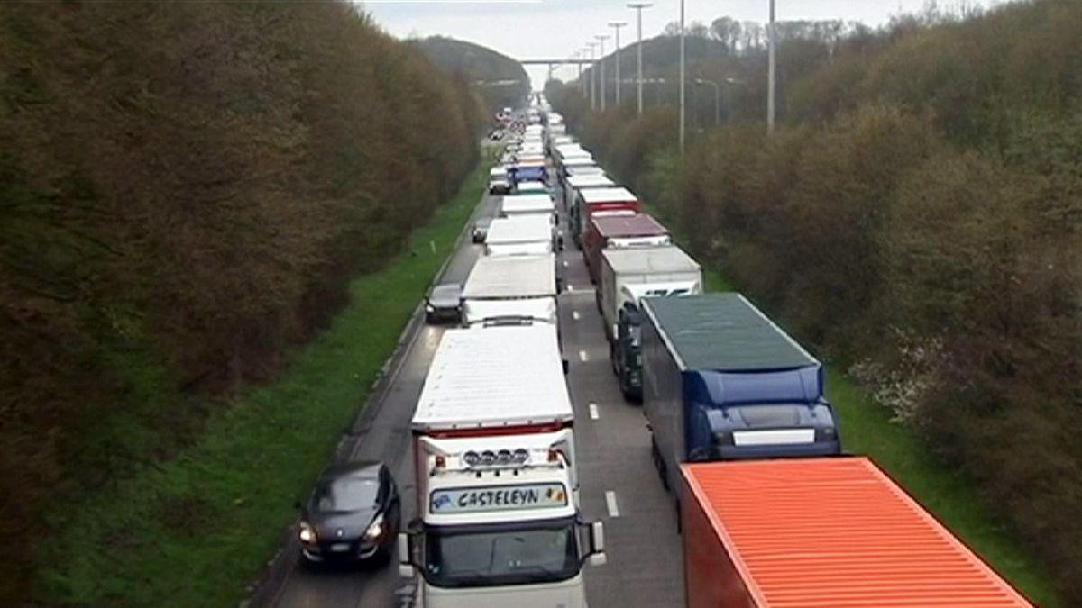 Truckers and farmers block Belgian roads in tax protest
