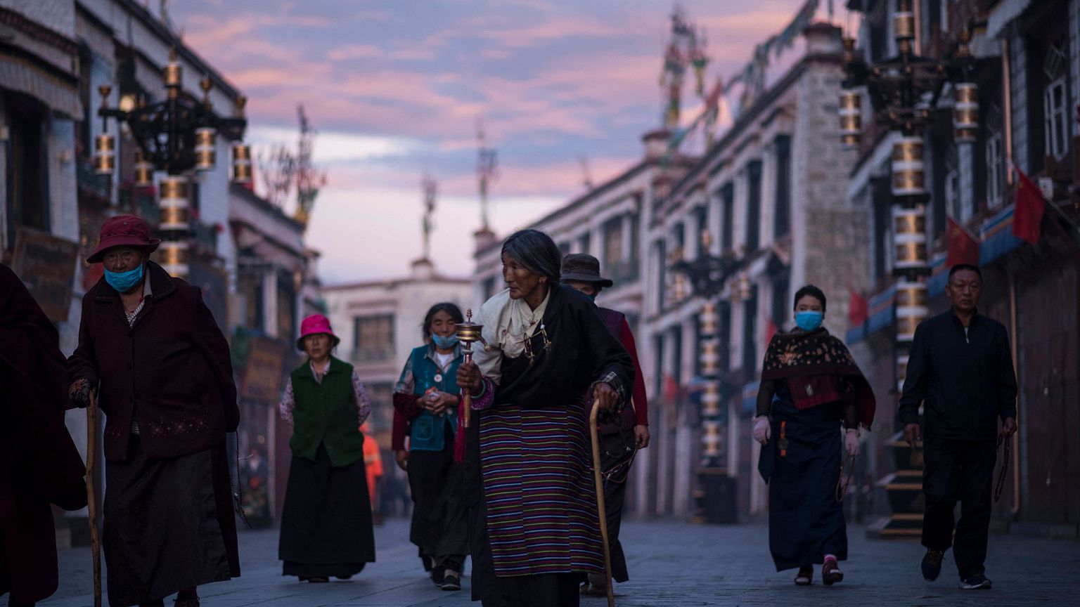 Image: Pilgrims walking and praying near the Jokhang Temple