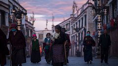Image: Pilgrims walking and praying near the Jokhang Temple