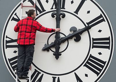 A technician working on the clock of the Lukaskirche Church in Dresden, eastern Germany.