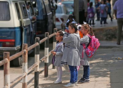 Children gather outside UNRWA-run school in Gaza City on Wednesday.
