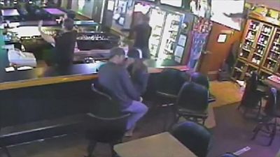 Couple carry on kissing despite armed robbery