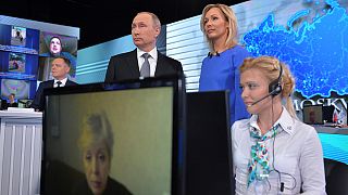 Putin defends Russia's Syrian intervention and withdrawal in TV phone-in