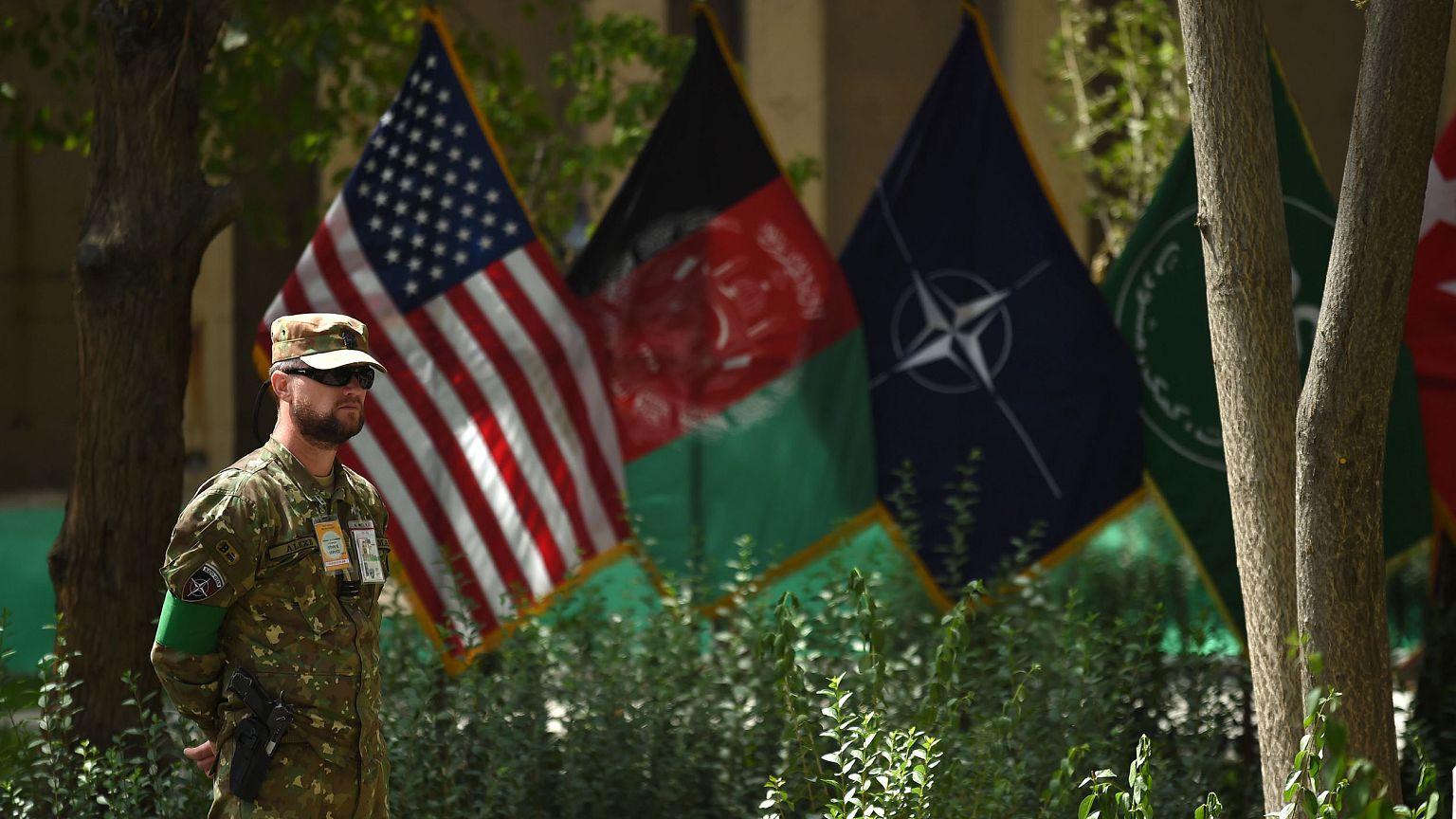 Image: An U.S. military personnel stands during a change of command ceremon
