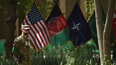 Image: An U.S. military personnel stands during a change of command ceremon