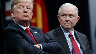 Image: President Donald Trump, left, sits with Attorney General Jeff Sessio