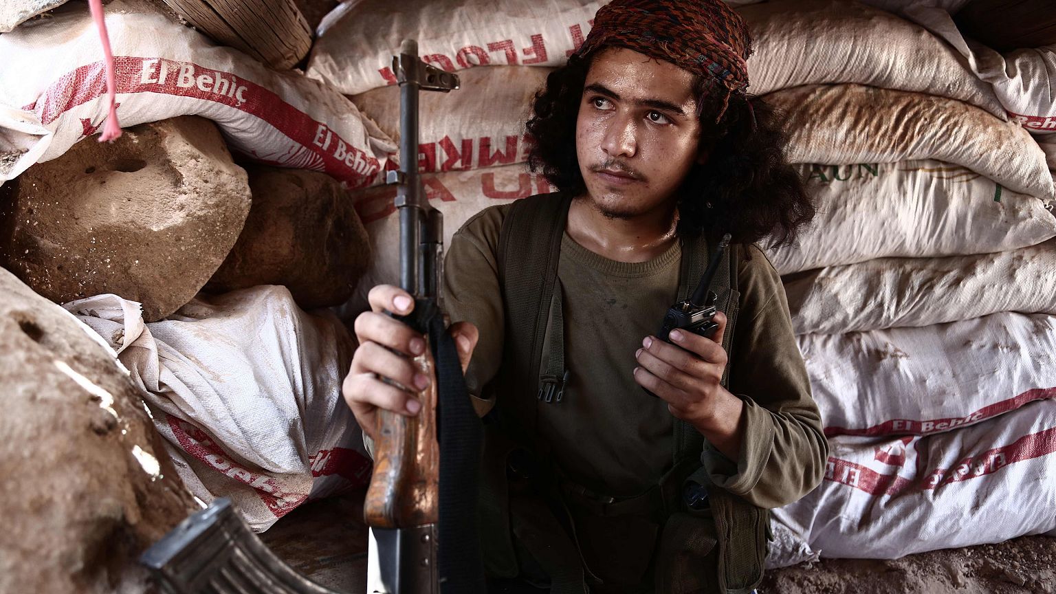 Image: A Syrian rebel fighter from the recently-formed "National Liberation