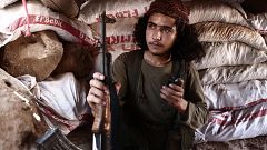 Image: A Syrian rebel fighter from the recently-formed "National Liberation