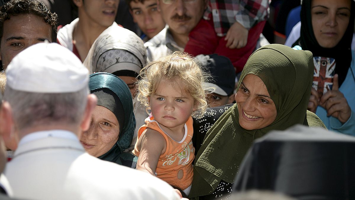 Pope Francis face-to-face with refugees