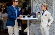 Image: A couple drink Italian coffee outside Jil Sander during the Milan Me