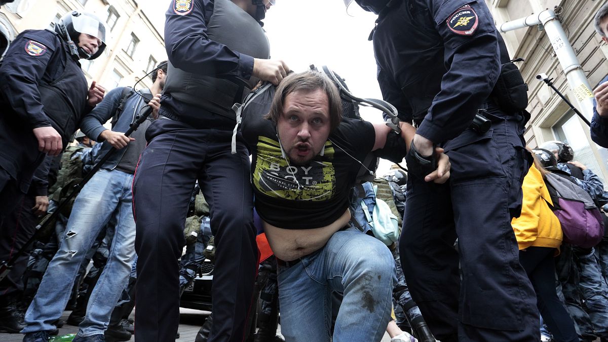 Image: A protester is detained in St. Petersburg, Russia